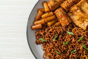 Jajangmyeon or JJajangmyeon with Odeng and Omuk - Korean Instant noodles with Korean fish cake in black bean sauce photo