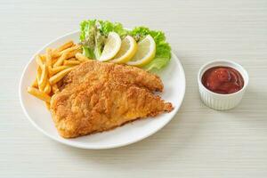 Homemade Breaded Weiner Schnitzel with Potato Chips photo