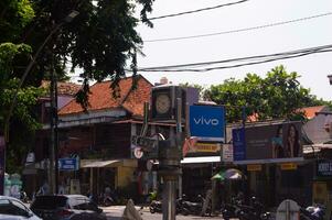 gresik, indonesia, 2022 - selective focus on the clock monument at the crossroads photo
