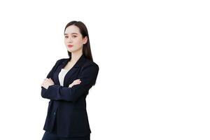 Young beautiful asian professional businesswoman successful with crossed arms in office workspace while looking at camera while isolated on white background. photo