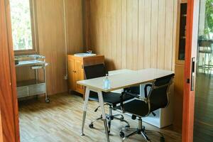 Medical professional workspace with table and first aid equipment in room. medicine and healthcare concept photo