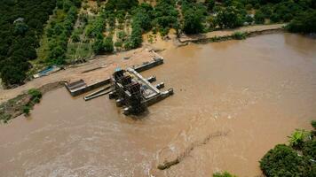 Flooding the floodgate construction, unfinished construction. The river bank collapsed due to heavy rain and strong water flow. photo