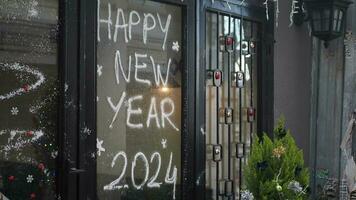 Welcome 2024 on cafe window . New year concept. video