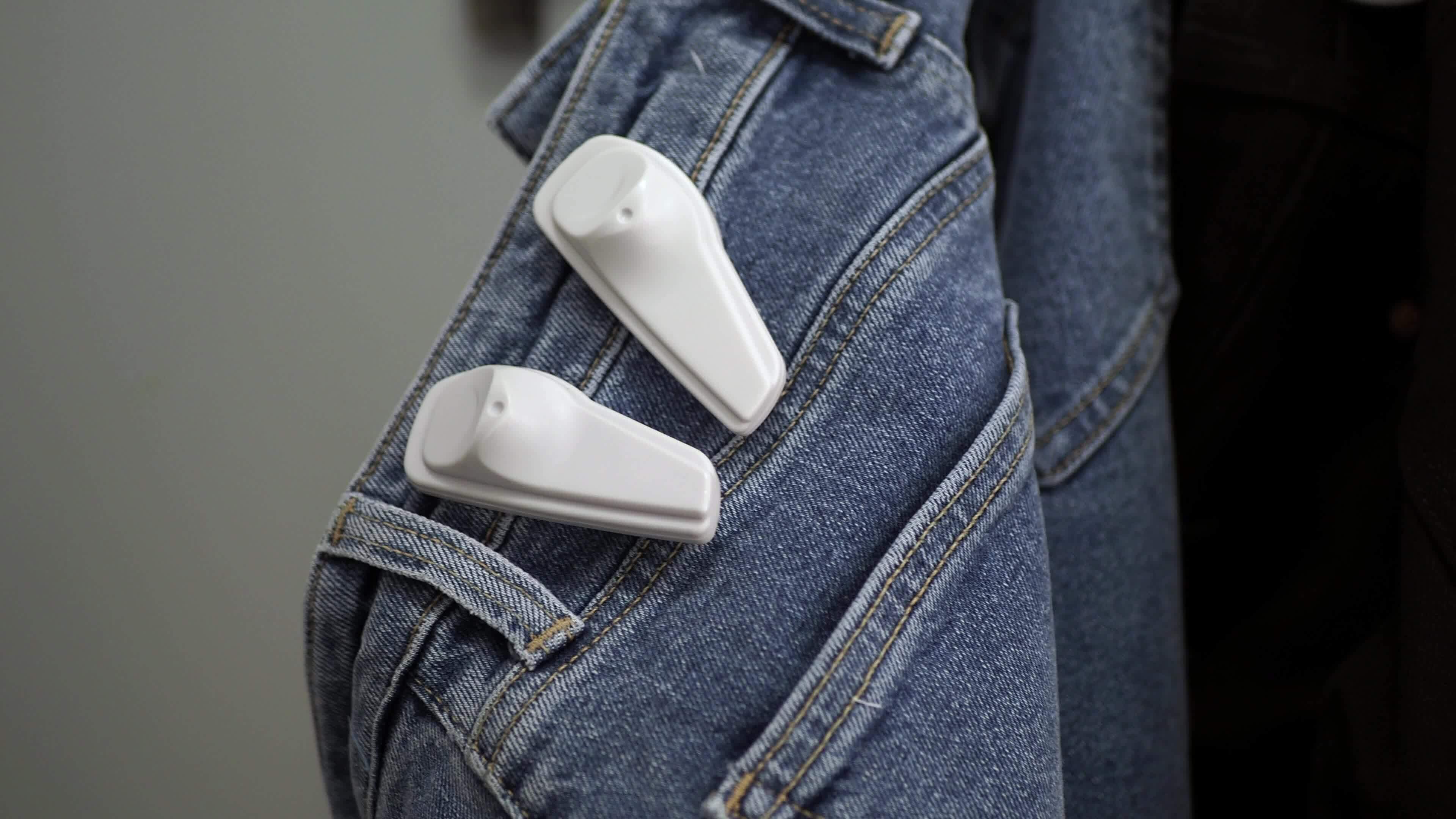 Clothing security tag on a jeans , 36607523 Stock Video at Vecteezy