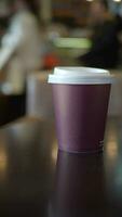 Blank take away kraft coffee cup on table , video