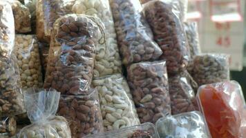 many mixed nuts in a plastic packet on shelf video