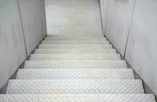 White staircase steel floor plate texture.  Abstract black metal sheet stair photo