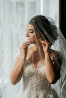 portrait of the bride in a wedding dress under a veil. photo