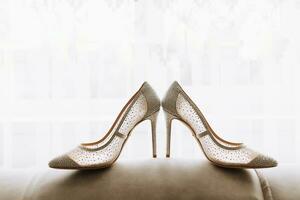 fashionable, wedding, women's high-heeled shoes of beige color on a white background photo