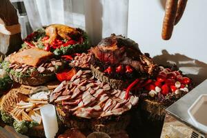 Cossack table in the best restaurants. Festive table at the wedding. National Ukrainian cuisine. Fat, sausages, alcohol. Catering. photo