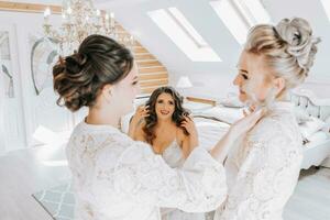 girlfriends rejoice with the bride and help prepare for the wedding. photo