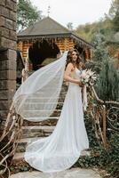Photo of the bride in full height on elegant steps