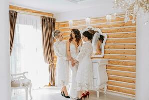 girlfriends rejoice with the bride and help prepare for the wedding. photo