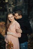 Autumn mood during pregnancy, how to be happy and healthy in autumn. Support of the husband during pregnancy. Take care of life, health and well-being. The beauty of a woman during pregnancy. photo