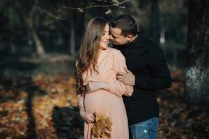 Autumn mood during pregnancy, how to be happy and healthy in autumn. Support of the husband during pregnancy. Take care of life, health and well-being. The beauty of a woman during pregnancy. photo