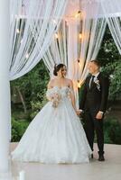 Beautiful wedding couple at a summer wedding ceremony. Wedding vows, emotions and tears photo