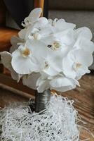 wedding bouquet of white orchid. A bouquet of flowers on the wedding day photo