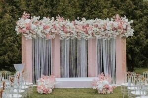 Ceremony, Arch, Wedding Arch, Wedding, Wedding Moment, Decorations, Decor, Wedding Decorations, Flowers, Chairs, Outdoor Ceremony, Flower Bouquets. photo