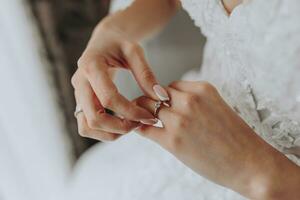 Gold wedding rings on the bride's hand, close-up photo