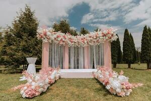 Ceremony, Arch, Wedding Arch, Wedding, Wedding Moment, Decorations, Decor, Wedding Decorations, Flowers, Chairs, Outdoor Ceremony, Flower Bouquets. photo