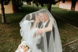 Couple, love or wedding dress veil after marriage event, ceremony or union in nature environment. Smile, happy or trust man or woman or bride and groom bonding after romance celebration by water lake photo