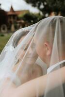 Couple, love or wedding dress veil after marriage event, ceremony or union in nature environment. Smile, happy or trust man or woman or bride and groom bonding after romance celebration by water lake photo