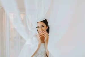 Beautiful bride. portrait. wedding makeup hairstyle, gorgeous young woman in white dress at home. series photo
