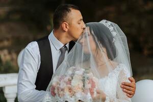 happy newlywed wife and husband outdoors and enjoying their wedding day. Sincere feelings of two young people. The concept of true love. photo