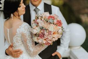 happy newlywed wife and husband outdoors and enjoying their wedding day. Sincere feelings of two young people. The concept of true love. photo