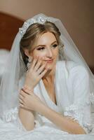 Luxury wedding crown diadem on bride's head hairstyle. morning wedding preparation bride with crown close up photo