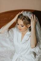 Luxury wedding crown diadem on bride's head hairstyle. morning wedding preparation bride with crown close up photo