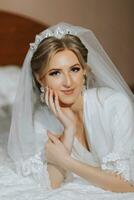 Luxury wedding crown diadem on bride's head hairstyle. morning wedding preparation bride with crown close up photo