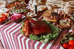 Snacks at the wedding, cheese, sausage, vegetables, meat products, Cossack table at the Ukrainian wedding. photo