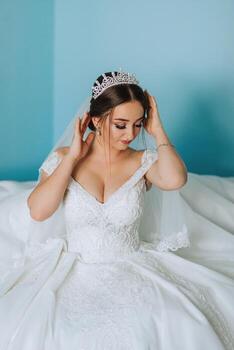 Portrait of an elegant and beautiful bride. Modern style. Diadem on the girl's head. Perfect makeup and hair photo