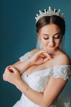 Portrait of an elegant and beautiful bride. Modern style. Diadem on the girl's head. Perfect makeup and hair photo