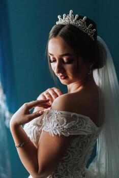 Portrait of an elegant and beautiful bride. Modern style. Diadem on the girl's head. Perfect makeup and hair photo