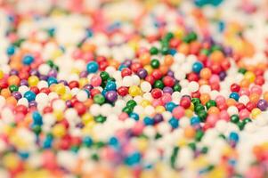 Colorful sugar sprinkles as a background. Macro shot with shallow depth of field. photo