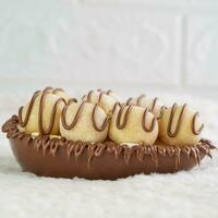 Nougat cookies in chocolate glaze on a white background. photo