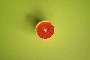 Grapefruit on a green background. Top view. Flat lay. photo