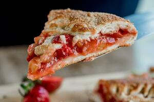 Strawberry strudel on a cutting board close up photo