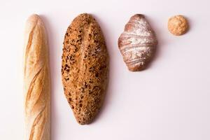 Different types of bread on a white background. View from above. photo