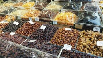 many date fruits display for sale at market in istanbul video