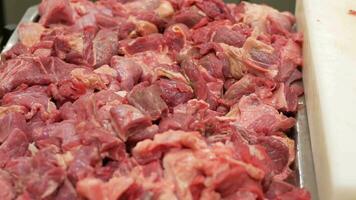 chopped red meat display at local store video