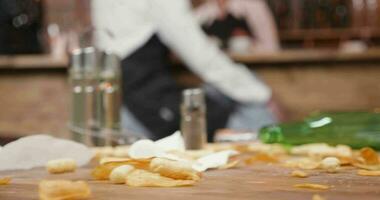 Very unclean wooden restaurant table after a busy day. Customers left a dirty table after a party. video