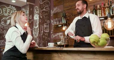 Slide shot of restaurant workers chatting after work. Smooth movement of camera. Vintage style coffee shop. video