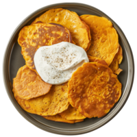 AI generated A plate of chickpea pancake with a dollop of cashew sour cream top view isolated on a transparent background png