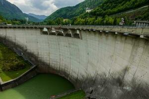 huge dam from a river in a wonderful mountain landscape photo