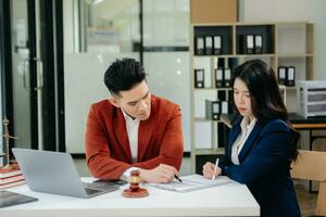 Business and Male lawyer or judge consult having team meeting with client, Law and Legal services concept.Customer service good cooperation photo