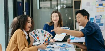 UX developer and ui designer brainstorming about mobile app interface wireframe design with customer breif and color code photo