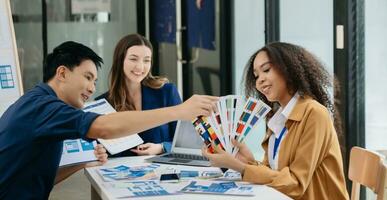 UX developer and ui designer brainstorming about mobile app interface wireframe design with customer breif and color code photo